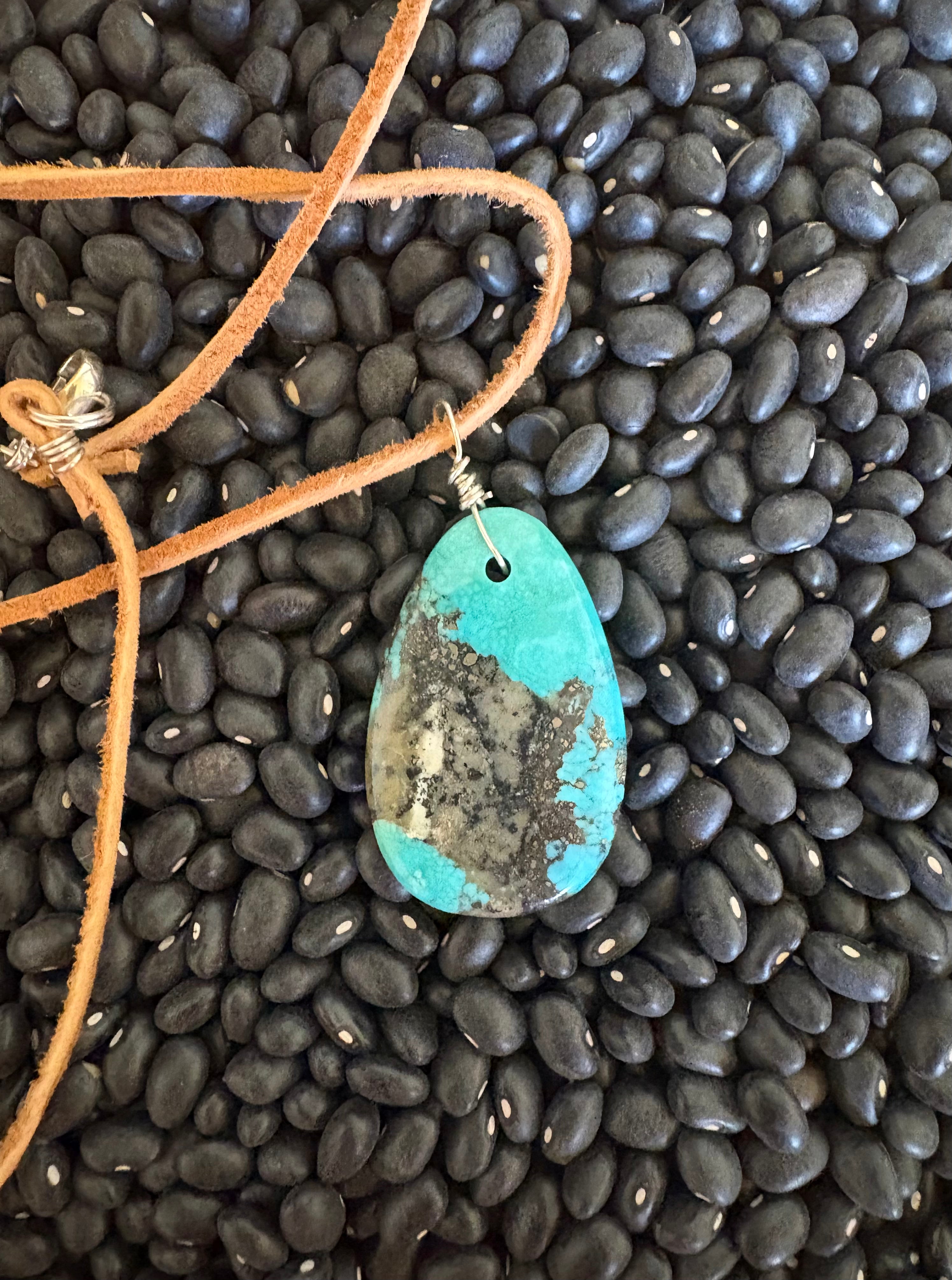 Leather necklace with turquoise stone. 24”