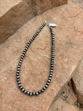 Machine made pearl necklace 16” 7mm