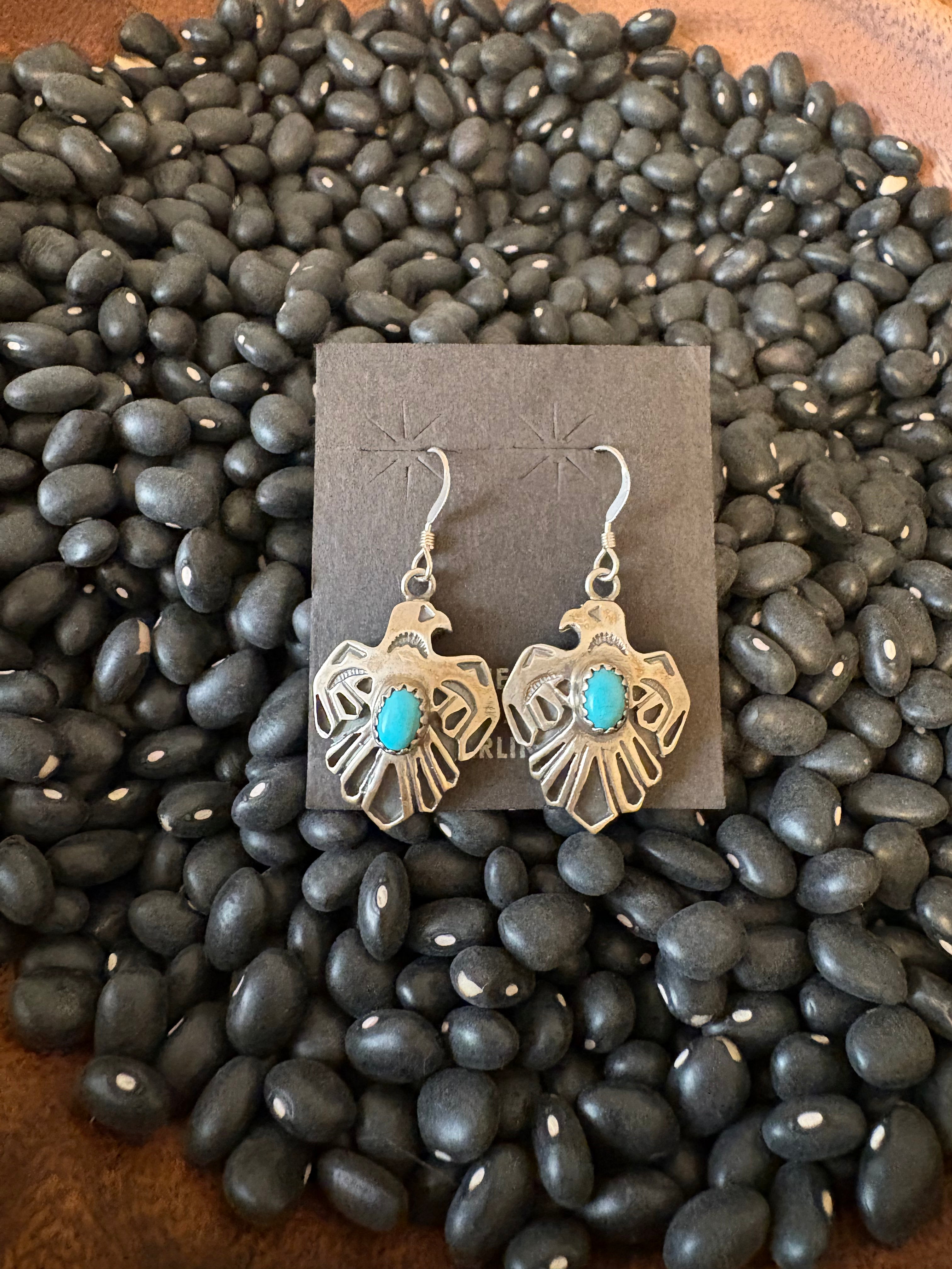 Sterling silver thunderbird earrings with turquoise.  Native made and stamped.