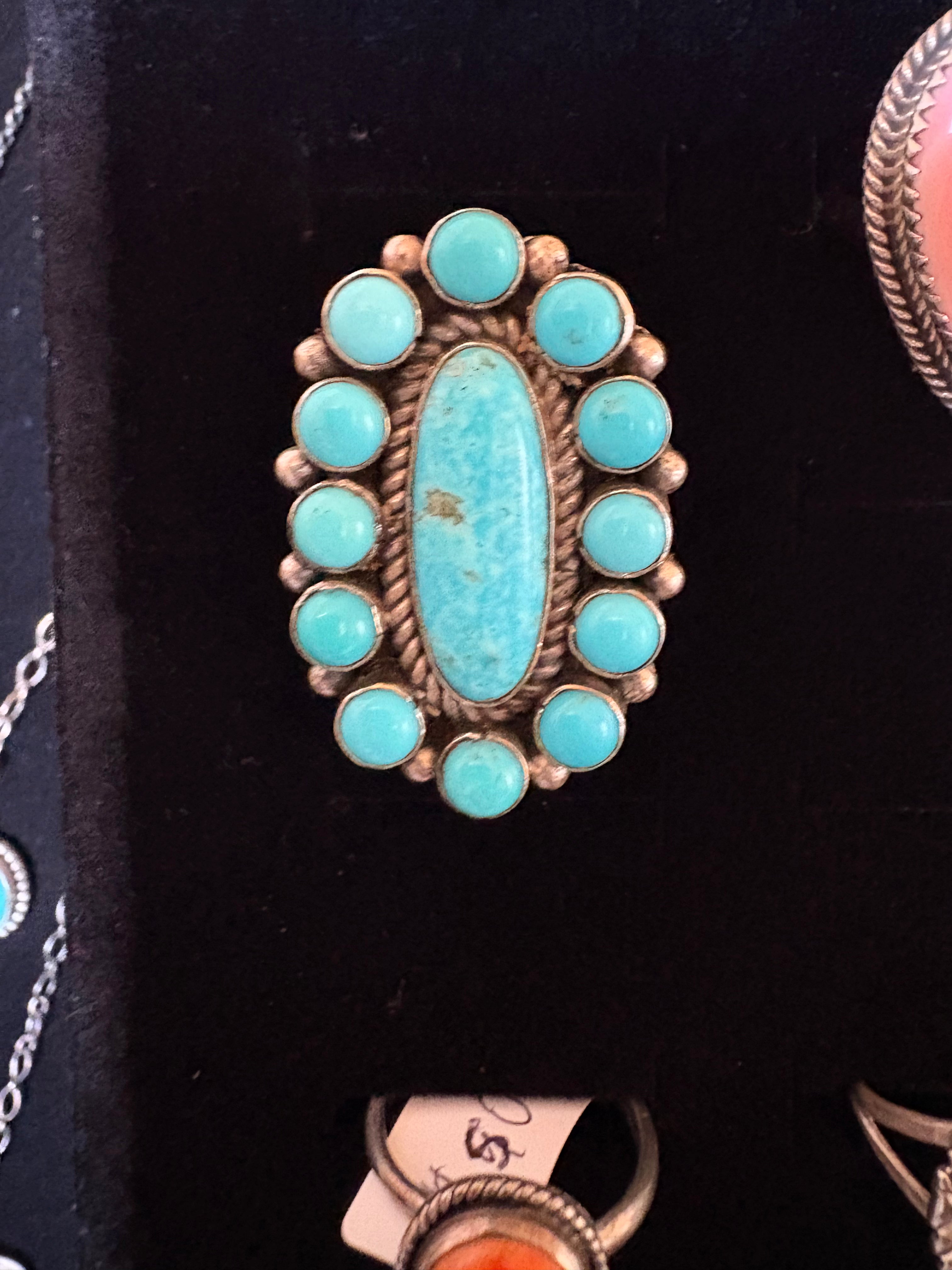 Sterling silver native made and stamped cluster Kingman turquoise ring. Size 9.5