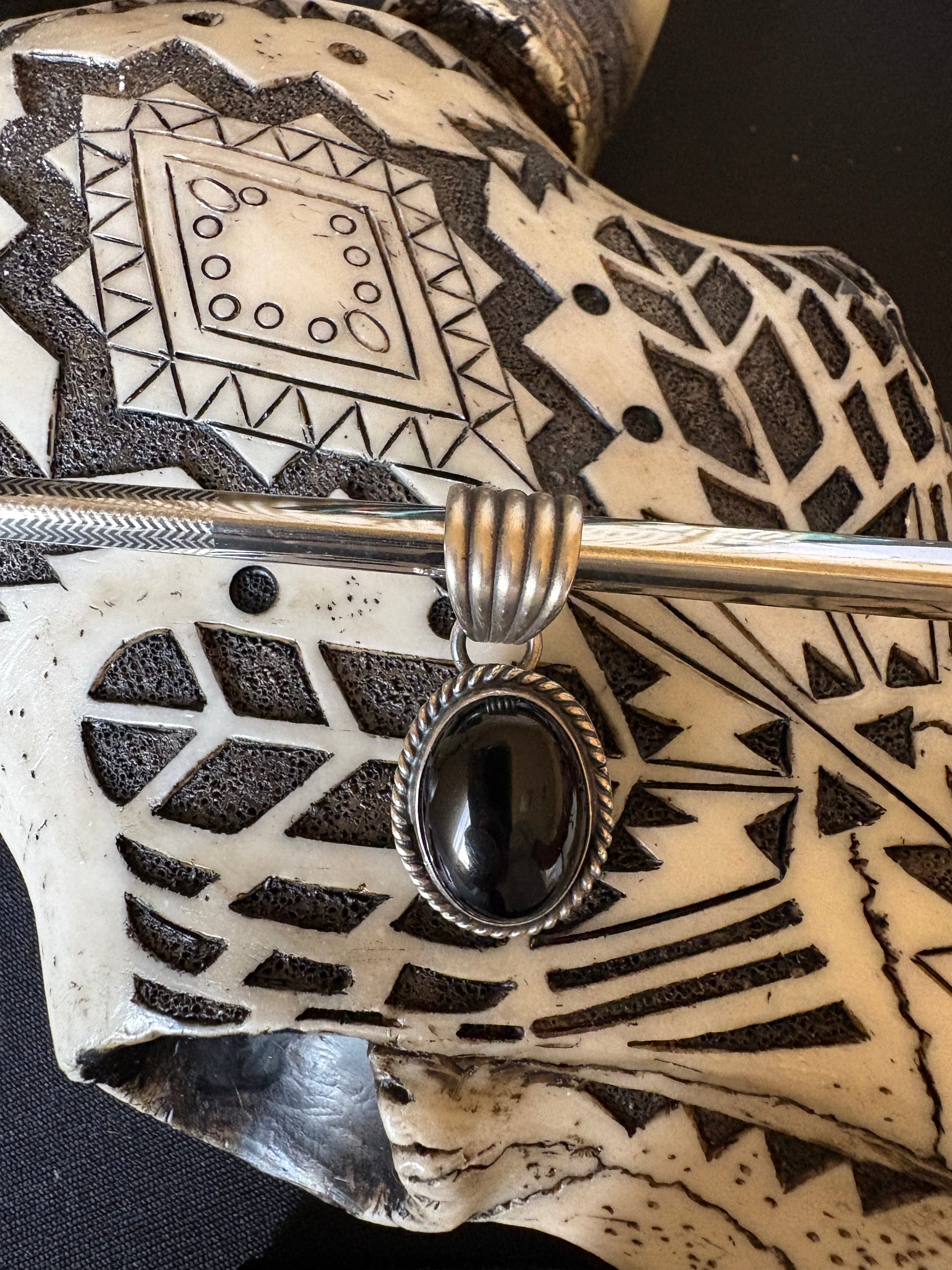Sterling silver black onyx pendent native made and stamped.