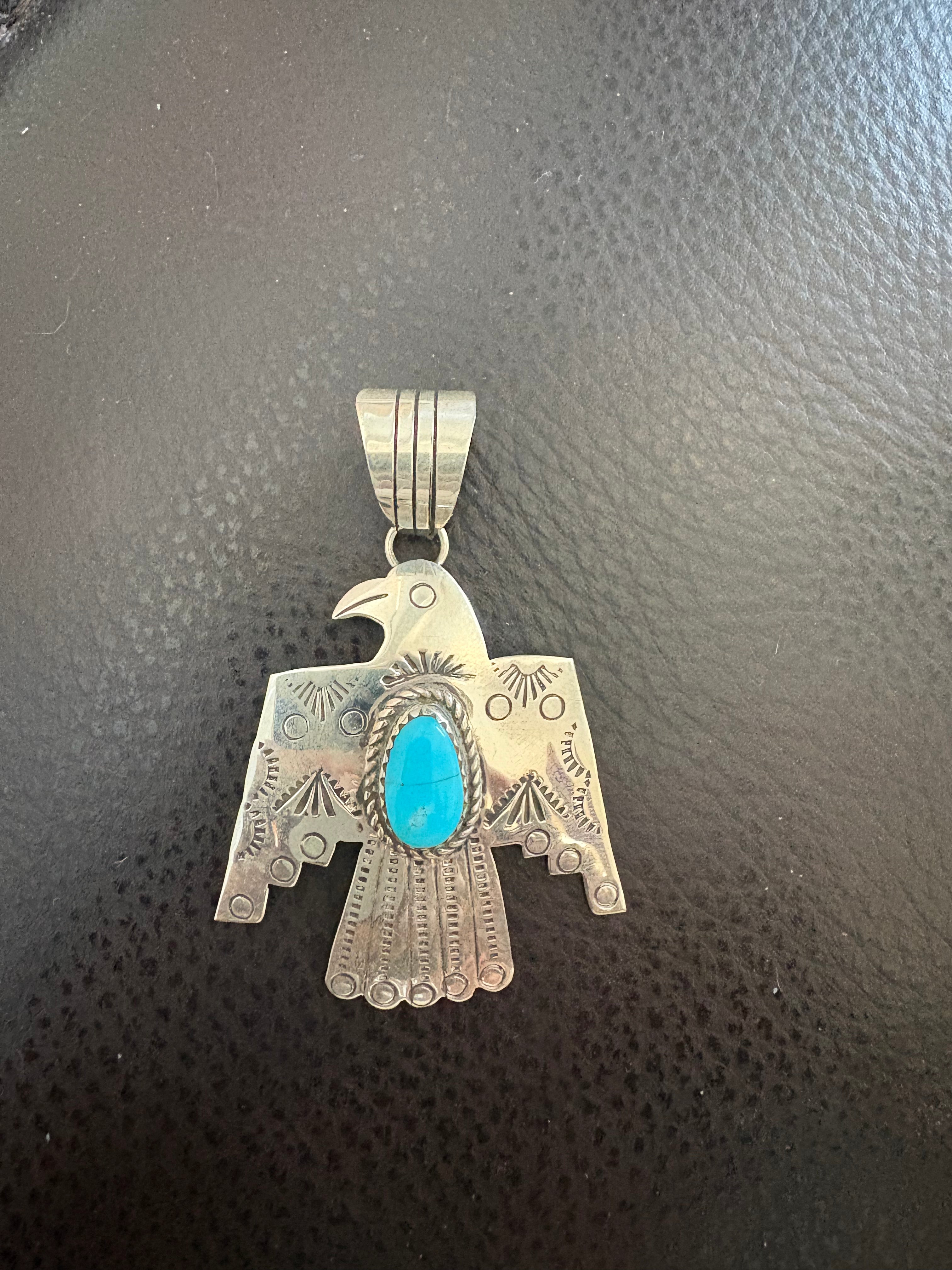Thunderbird pendent, with Kingman turquoise stone. Native made