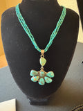 Three strand turquoise necklace with non native pendent