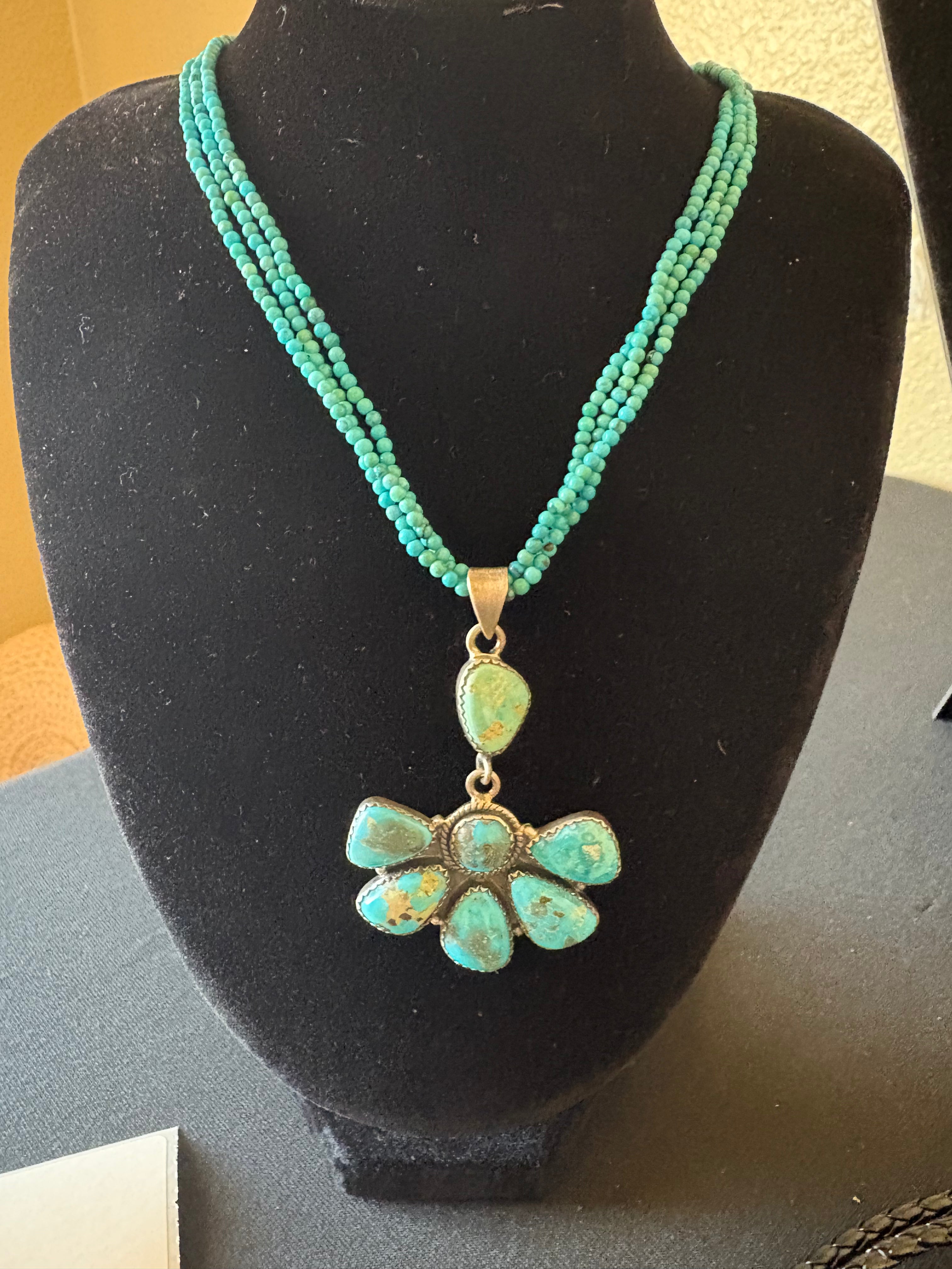 Three strand turquoise necklace with non native pendent