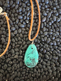 Leather necklace with turquoise stone. 24”