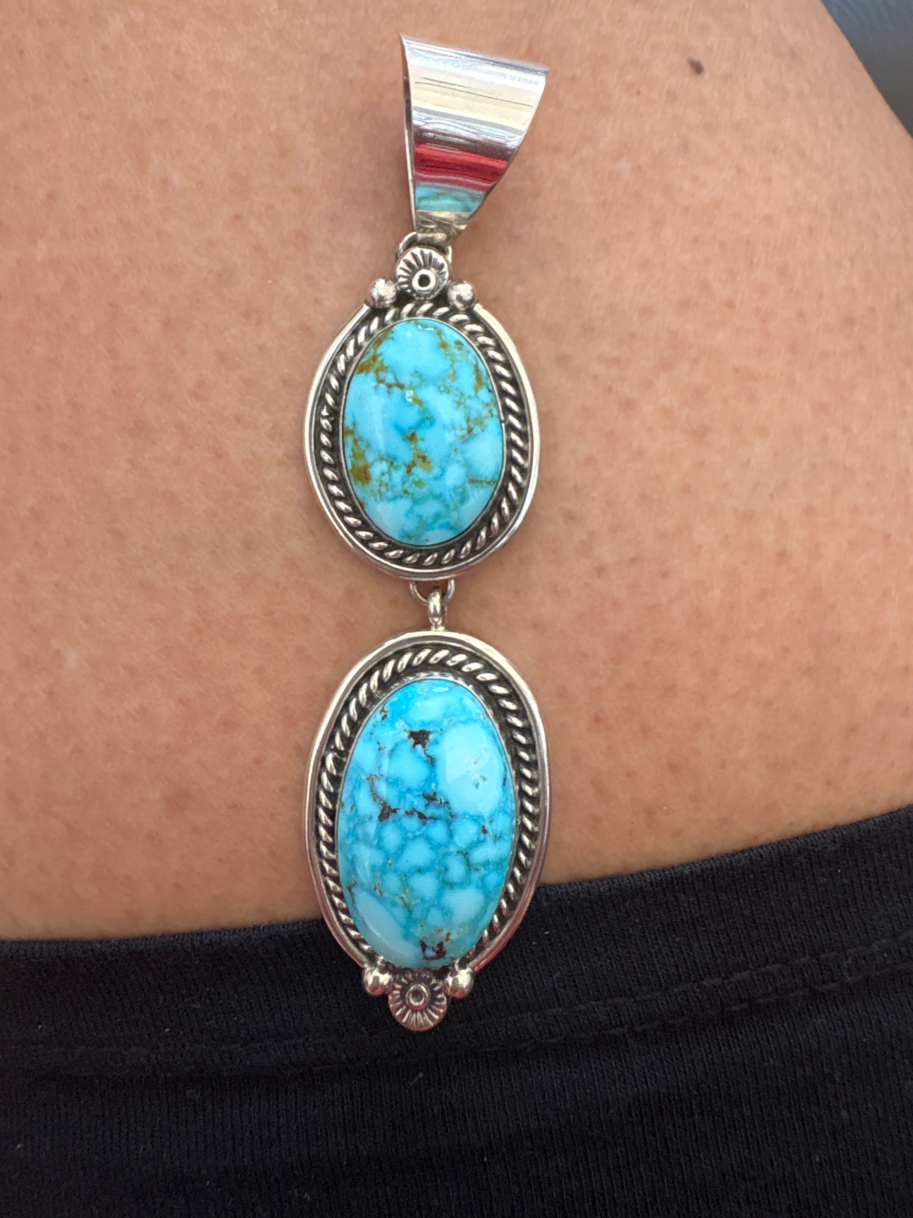 Sterling silver two stone turquoise pendent. Native made