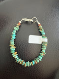 Turquoise bracelet with orange bead
