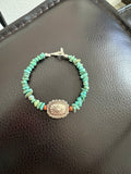 Turquoise bracelet with conch